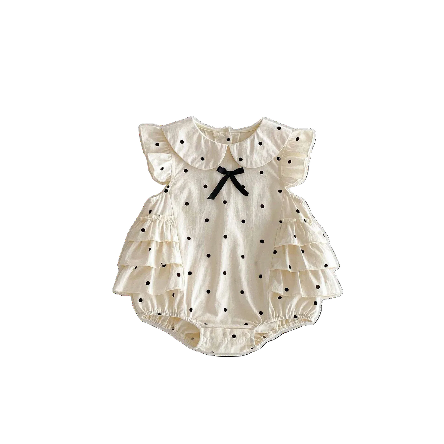 Ivory baby girl bubble romper featuring black polka dots, layered ruffle sleeves, a Peter Pan collar, and a black satin bow.